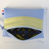 Pochette zippée rectangulaire en cuir d'agneau format mini bicolore bleu ciel vert anis