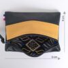 Mini pochette zippée rectangulaire en cuir d'agneau bicolore noir jaune curcuma